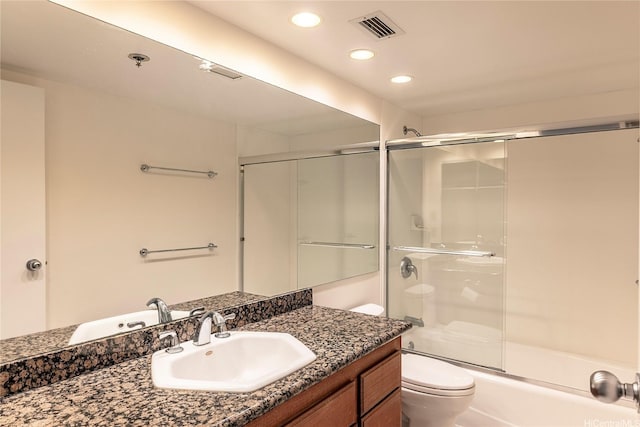 581 Kamoku St Unit 1008, Honolulu, HI 96826 - bathroom featuring visible vents, vanity, toilet, enclosed tub / shower combo, and recessed lighting