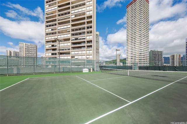 581 Kamoku St Unit 1008, Honolulu, HI 96826 - view of tennis court with fence and a city view