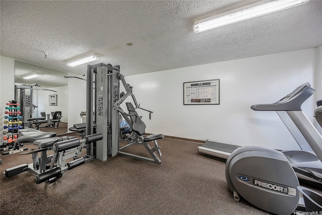 581 Kamoku St Unit 1008, Honolulu, HI 96826 - exercise room featuring a textured ceiling
