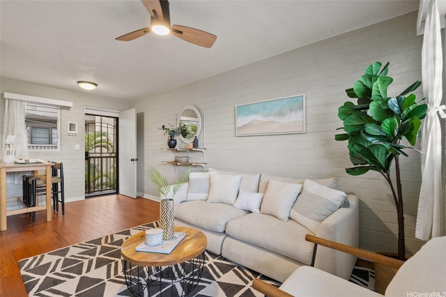 75 Kihapai St Unit 10, Kailua, HI 96734 - living area featuring baseboards, ceiling fan, and wood finished floors