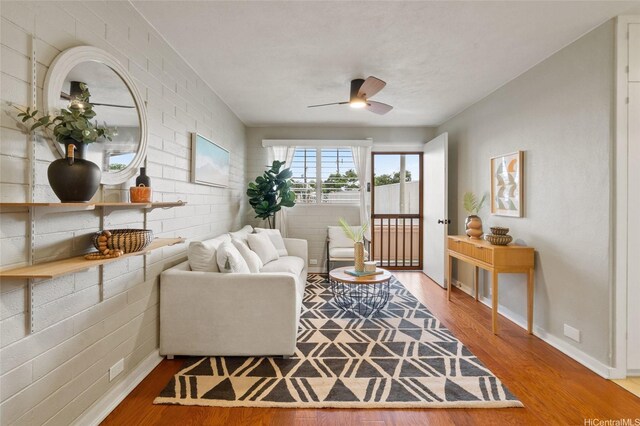 75 Kihapai St Unit 10, Kailua, HI 96734 - living room with baseboards, ceiling fan, and wood finished floors