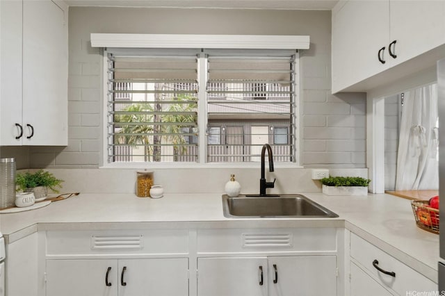 75 Kihapai St Unit 10, Kailua, HI 96734 - kitchen with a sink, white cabinetry, and light countertops