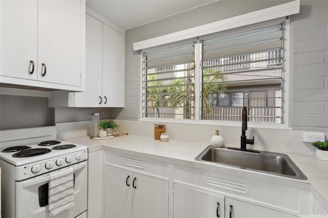 75 Kihapai St Unit 10, Kailua, HI 96734 - kitchen featuring white cabinets, a sink, light countertops, electric stove, and under cabinet range hood