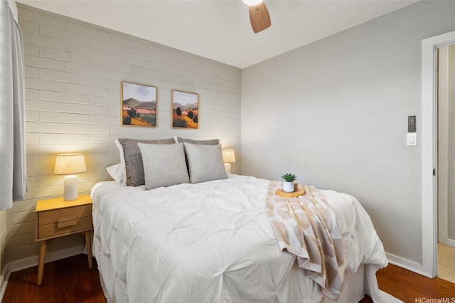 75 Kihapai St Unit 10, Kailua, HI 96734 - bedroom featuring baseboards, a ceiling fan, and wood finished floors