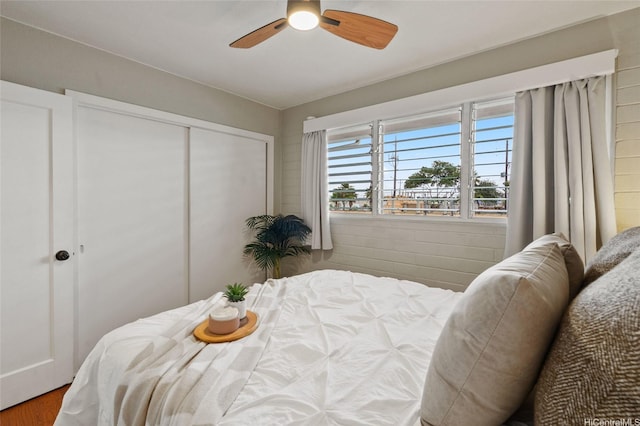 75 Kihapai St Unit 10, Kailua, HI 96734 - bedroom featuring a closet, a ceiling fan, and wood finished floors