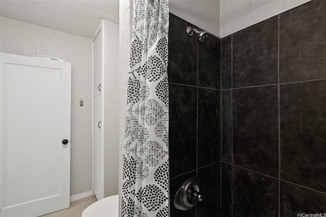 75 Kihapai St Unit 10, Kailua, HI 96734 - full bathroom with tile patterned flooring, toilet, and tiled shower