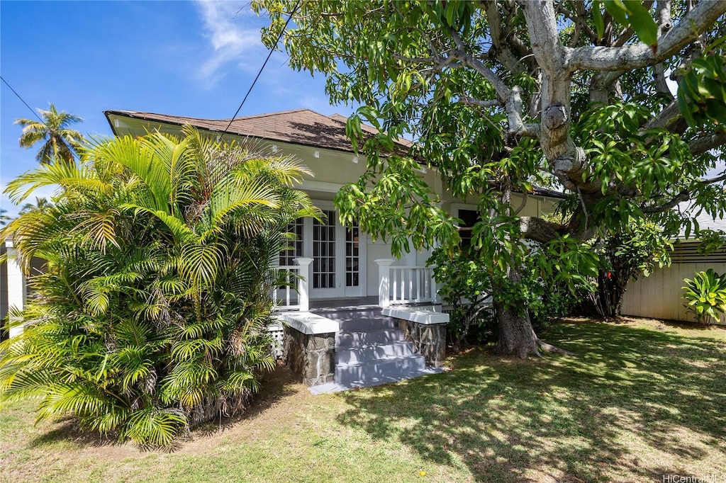 5307C Kalanianaole Hwy, Honolulu, HI 96821 - view of home's exterior featuring a yard, fence, and french doors