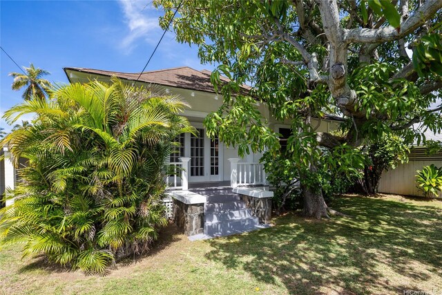 5307C Kalanianaole Hwy, Honolulu, HI 96821 - view of home's exterior featuring a yard, fence, and french doors