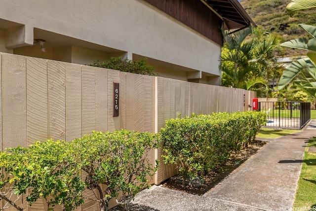 6215 Kawaihae Pl Unit B102, Honolulu, HI 96825 - view of property exterior featuring fence and stucco siding