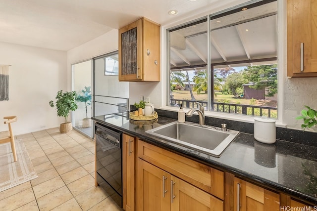 6215 Kawaihae Pl Unit B102, Honolulu, HI 96825 - kitchen featuring black dishwasher, a sink, plenty of natural light, and dark stone counters