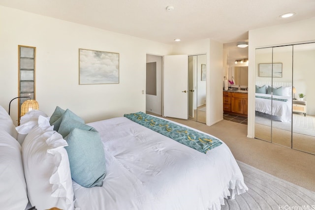 6215 Kawaihae Pl Unit B102, Honolulu, HI 96825 - bedroom featuring light colored carpet, ensuite bathroom, recessed lighting, and two closets