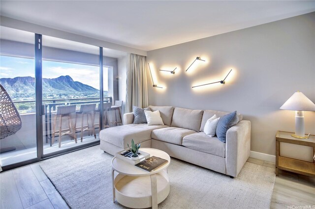 229 Paoakalani Ave Unit 1513, Honolulu, HI 96815 - living area with a mountain view and wood finished floors
