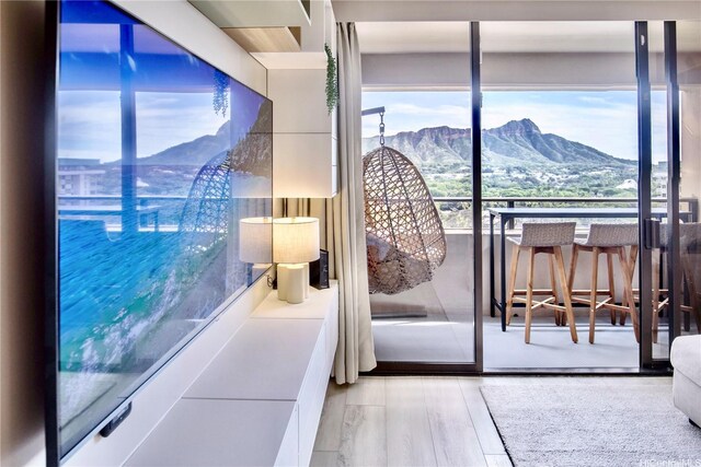 229 Paoakalani Ave Unit 1513, Honolulu, HI 96815 - bedroom with a mountain view and wood finished floors