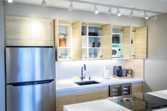 229 Paoakalani Ave Unit 1513, Honolulu, HI 96815 - kitchen featuring backsplash, a sink, track lighting, freestanding refrigerator, and white microwave