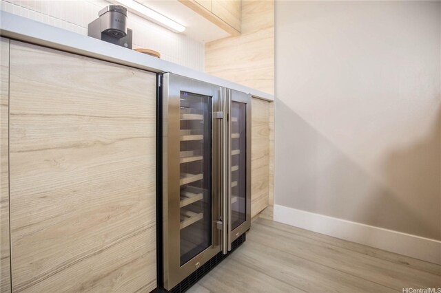 229 Paoakalani Ave Unit 1513, Honolulu, HI 96815 - room details featuring baseboards, wood finished floors, and wine cooler