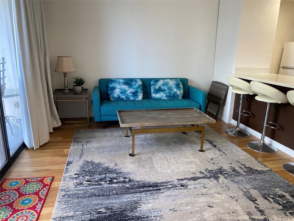 201 Ohua Ave Unit 1512, Honolulu, HI 96815 - living room featuring baseboards and wood finished floors