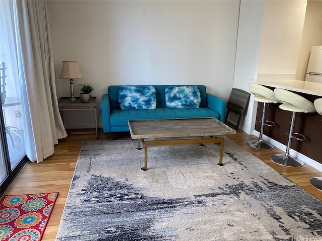 201 Ohua Ave Unit 1512, Honolulu, HI 96815 - living room featuring baseboards and wood finished floors