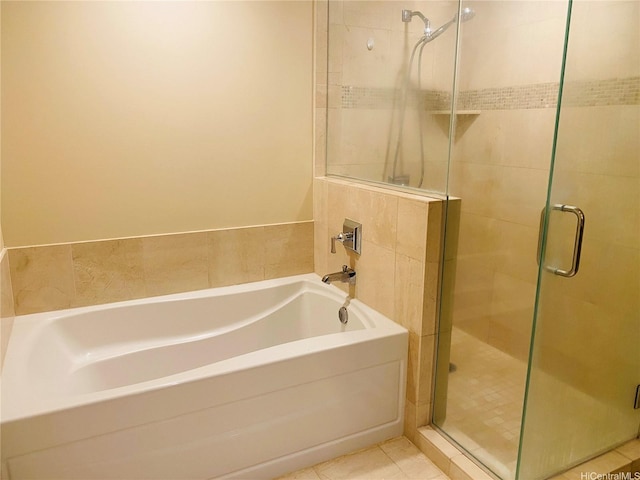 full bath with a garden tub and a shower stall
