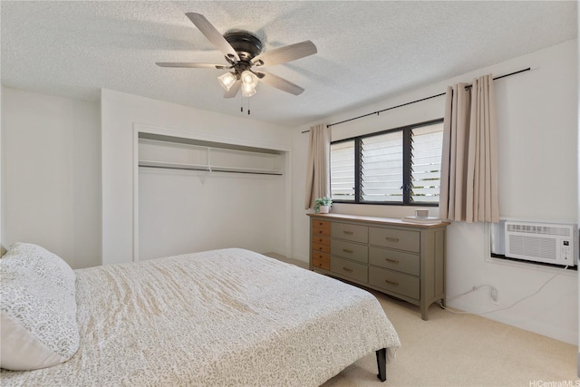 98-512 Kaonohi St Unit 49-3, Aiea, HI 96701 - bedroom featuring a ceiling fan, a closet, a textured ceiling, and light colored carpet