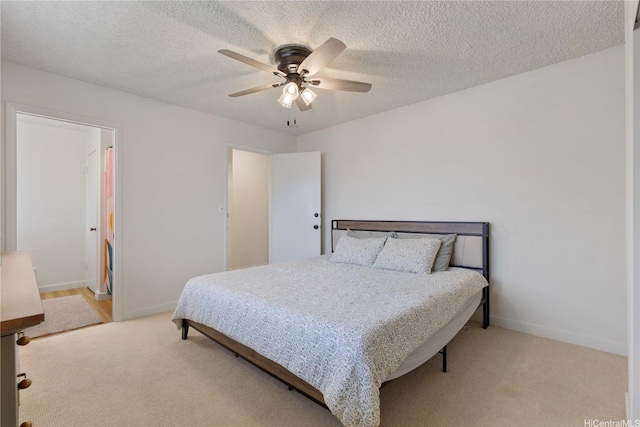 98-512 Kaonohi St Unit 49-3, Aiea, HI 96701 - bedroom featuring baseboards, ceiling fan, a textured ceiling, and light colored carpet