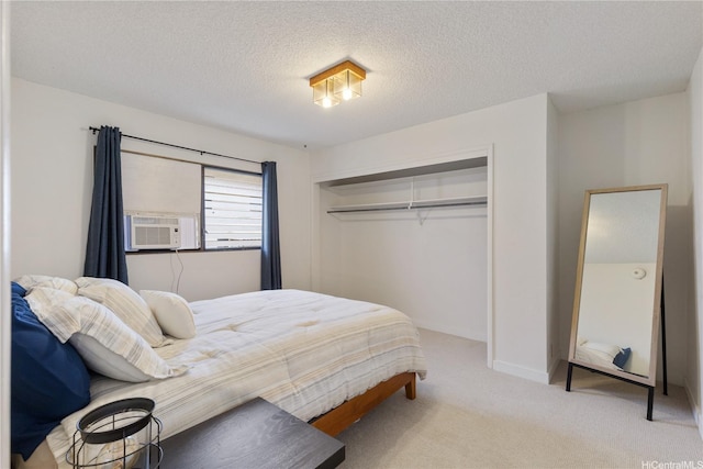 98-512 Kaonohi St Unit 49-3, Aiea, HI 96701 - bedroom featuring carpet floors, a closet, baseboards, a textured ceiling, and cooling unit