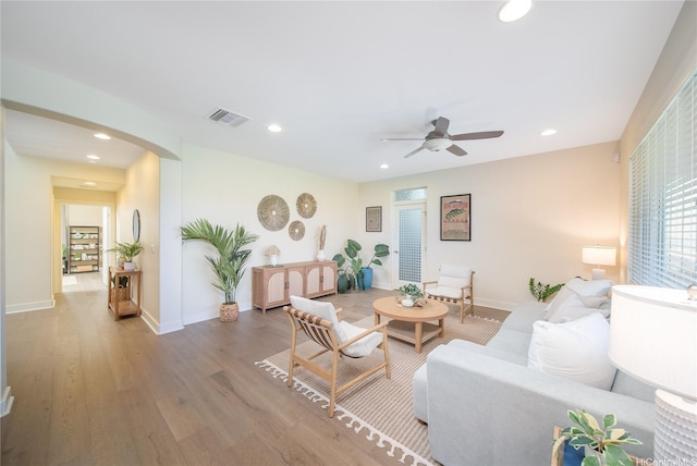 91-1243 Kuanoo St, Ewa Beach, HI 96706 - living room with wood finished floors, ceiling fan, arched walkways, recessed lighting, and baseboards