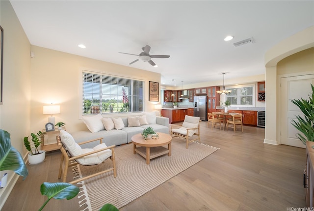 91-1243 Kuanoo St, Ewa Beach, HI 96706 - living room featuring wine cooler, ceiling fan, light wood-style flooring, healthy amount of natural light, and recessed lighting