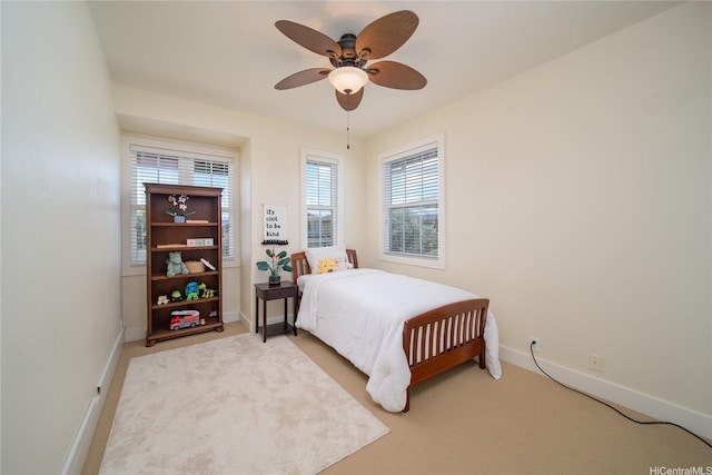 91-1243 Kuanoo St, Ewa Beach, HI 96706 - bedroom featuring baseboards, light carpet, and ceiling fan