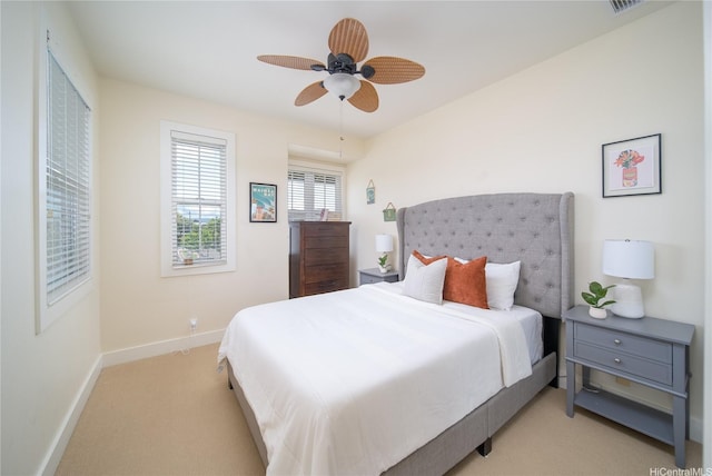 91-1243 Kuanoo St, Ewa Beach, HI 96706 - bedroom with light colored carpet, baseboards, and ceiling fan
