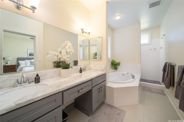 91-1243 Kuanoo St, Ewa Beach, HI 96706 - ensuite bathroom featuring a garden tub, double vanity, tile patterned floors, and a tile shower
