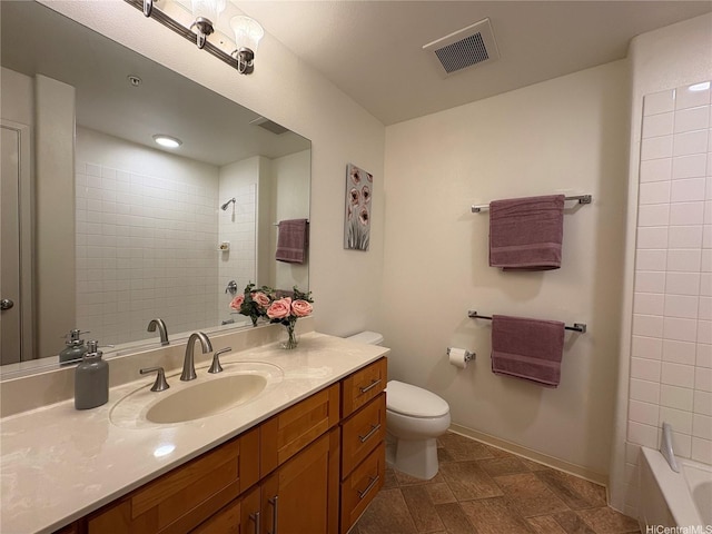 bathroom with visible vents, baseboards, toilet, and vanity