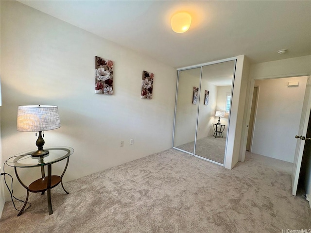 bedroom with a closet and carpet flooring