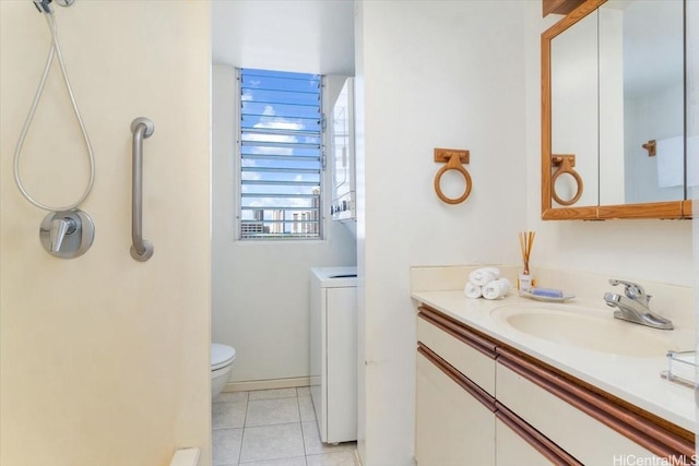 796 Isenberg St Unit 11A, Honolulu, HI 96826 - bathroom featuring tile patterned floors, vanity, toilet, and washer / clothes dryer