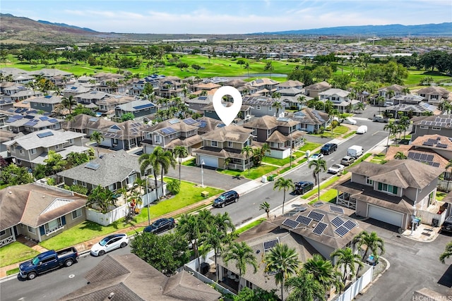 birds eye view of property featuring view of golf course, a residential view, and a mountain view
