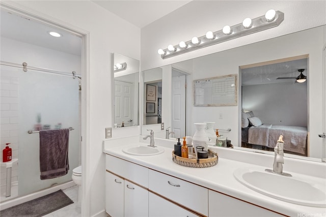 ensuite bathroom featuring double vanity, a sink, connected bathroom, and a shower