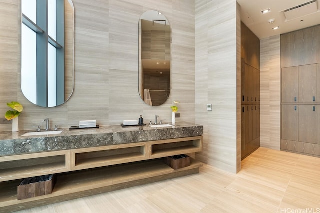 1000 Auahi St Unit 1404, Honolulu, HI 96814 - full bathroom featuring double vanity, a sink, and tile walls