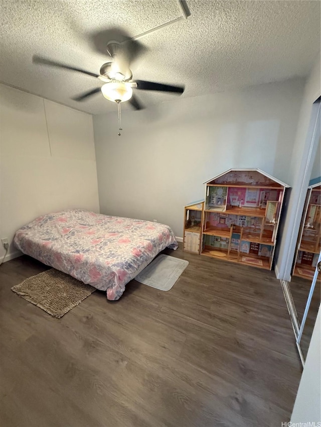 95-020 Waihonu St Unit C402, Mililani, HI 96789 - bedroom with ceiling fan, a textured ceiling, and wood finished floors