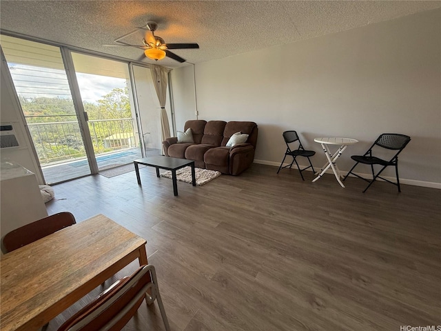 95-020 Waihonu St Unit C402, Mililani, HI 96789 - living room with baseboards, a textured ceiling, ceiling fan, and dark wood-style floors