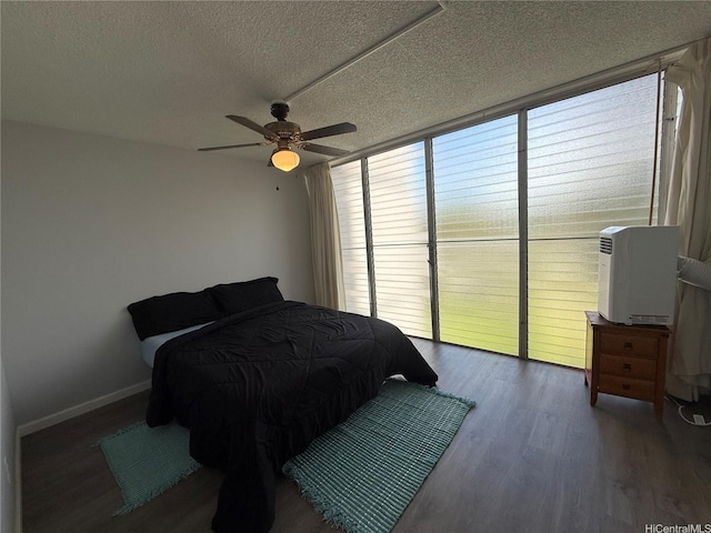 95-020 Waihonu St Unit C402, Mililani, HI 96789 - bedroom featuring baseboards, a ceiling fan, a textured ceiling, and wood finished floors