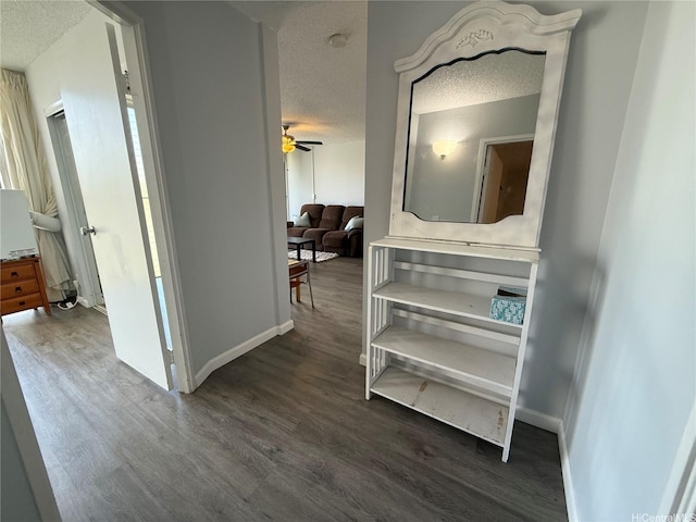 95-020 Waihonu St Unit C402, Mililani, HI 96789 - hall with baseboards, dark wood-style floors, and a textured ceiling