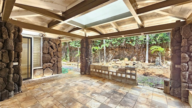 view of patio / terrace featuring fence