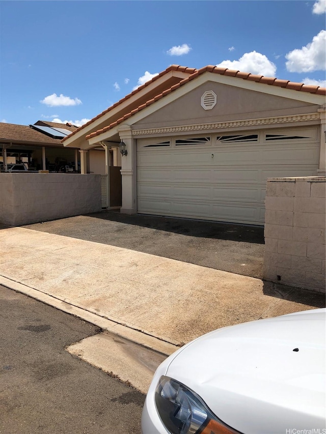 exterior space featuring fence and driveway