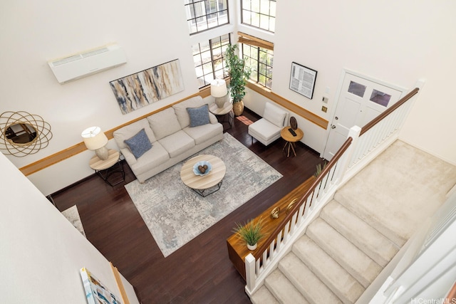91-1046 Apaa St, Ewa Beach, HI 96706 - living room featuring stairs, a high ceiling, and wood finished floors