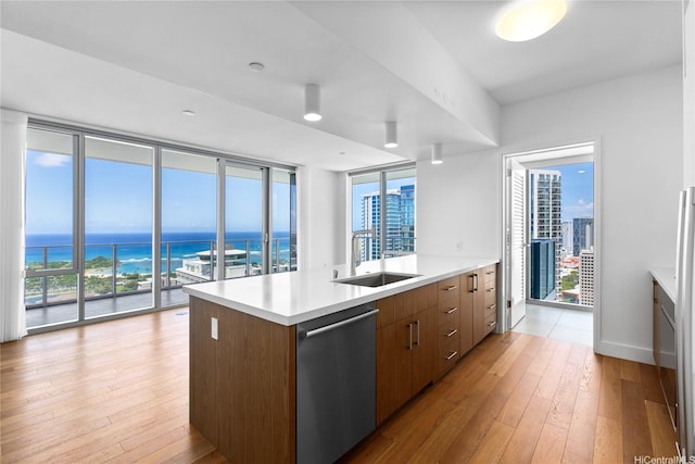 629 Keeaumoku St Unit 3401, Honolulu, HI 96814 - kitchen with light countertops, expansive windows, a sink, light wood finished floors, and dishwasher