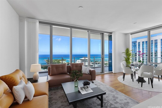 629 Keeaumoku St Unit 3401, Honolulu, HI 96814 - living area with a water view, floor to ceiling windows, and wood finished floors