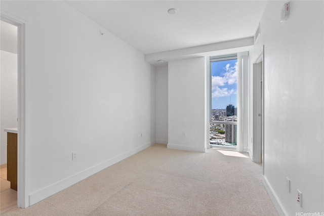 629 Keeaumoku St Unit 3401, Honolulu, HI 96814 - empty room with light colored carpet, baseboards, and visible vents