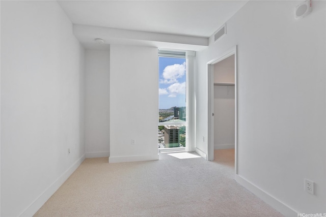 629 Keeaumoku St Unit 3401, Honolulu, HI 96814 - empty room featuring baseboards, carpet, and visible vents