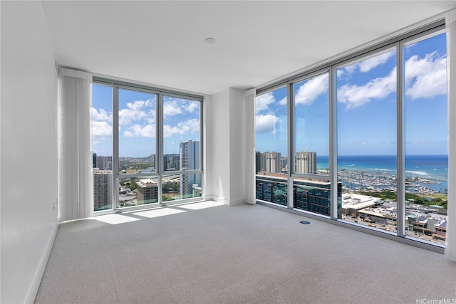 629 Keeaumoku St Unit 3401, Honolulu, HI 96814 - empty room with a view of city, floor to ceiling windows, a wealth of natural light, and carpet