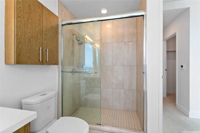 629 Keeaumoku St Unit 3401, Honolulu, HI 96814 - bathroom with vanity, a walk in closet, a stall shower, and toilet