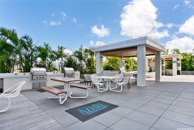 629 Keeaumoku St Unit 3401, Honolulu, HI 96814 - view of patio with a gazebo, outdoor dining space, exterior kitchen, and area for grilling